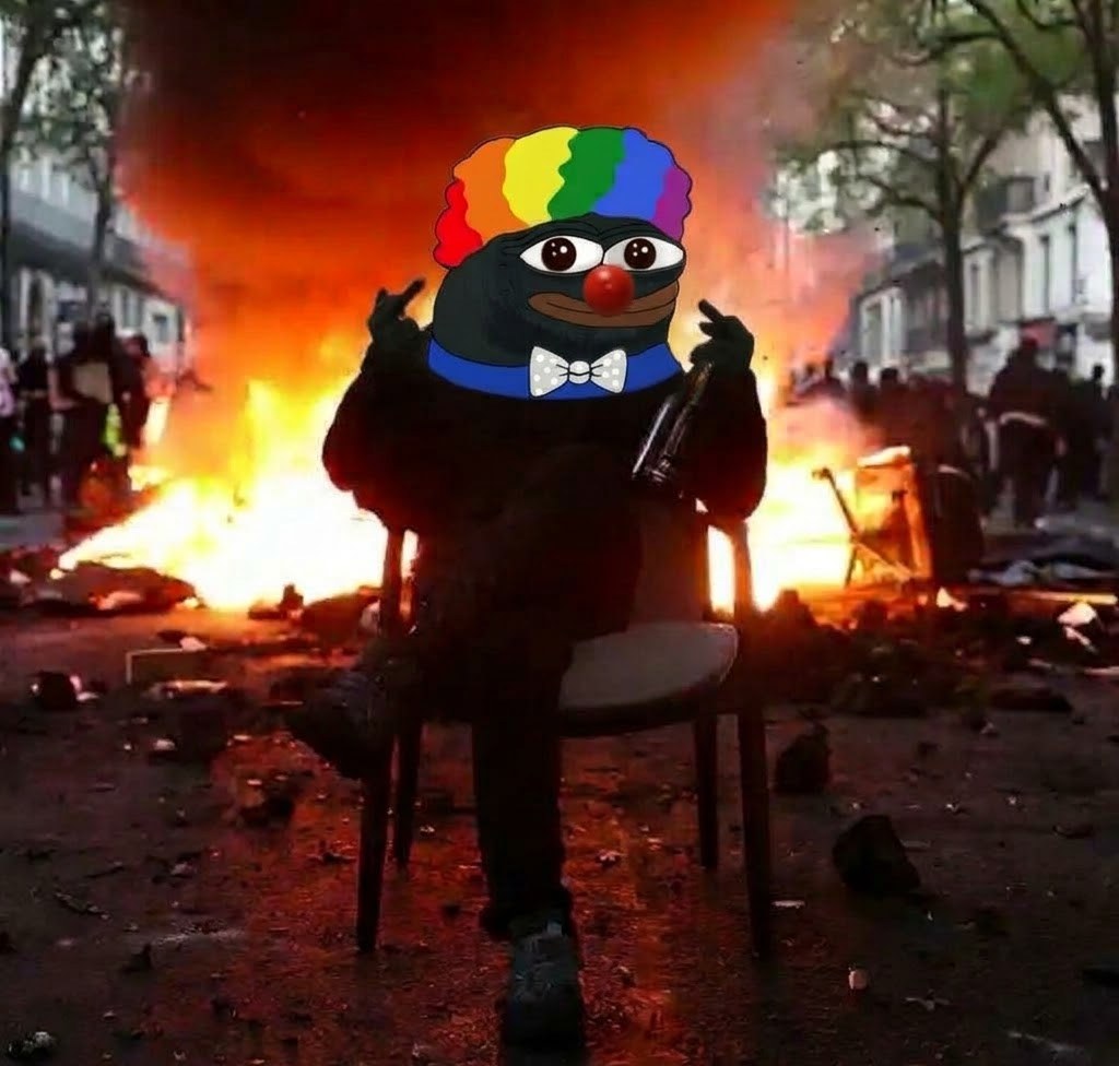 Clown Pepe sitting on a chair in a Paris street, barricades burning behind him